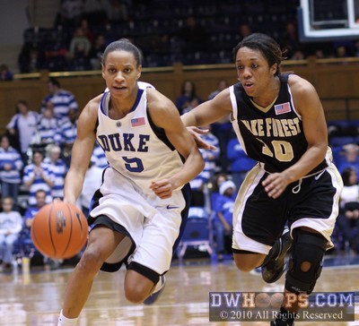 Jasmine Thomas drives past Tiffany Roulhac -  - 
