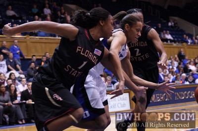 The determination and focus of Jasmine Thomas as she chases a loose ball with FSU's Angel Gray (1) and Alysha Harvin -  - 