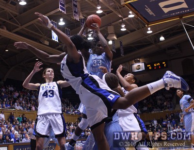 Laura Broomfield (33) pulls down a defensive rebound for the Tar Heels -  - 