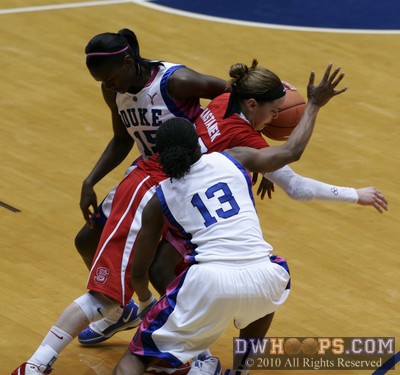 Marissa Kastanek fights through a Bridgette Mitchell (15) and Karima Christmas double team -  - 