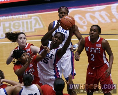 Bridgette Mitchell grabs a rebound in the crowded Duke lane -  - 