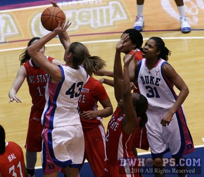 As all 5 NC State defenders converge on the lane, Keturah Jackson encourages a shooting Allison Vernerey -  - 