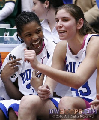 Keturah Jackson and Allison Vernerey share a happy moment on the Duke bench. -  - 