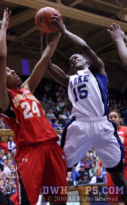 Bridgette Mitchell (15) and Diandra Tchatchouang battle for a rebound -  - 