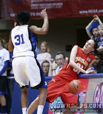 Lori Bjork hits the boards after a push from Keturah Jackson -  - 