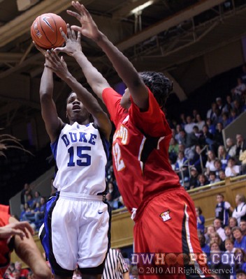 Bridgette Mitchell tries to shoot over Lynetta Kizer -  - 