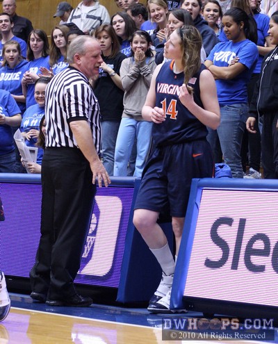 Referee Lawson Newton asks Lexie Gerson if she's OK after a fall over the press table into the stands -  - 