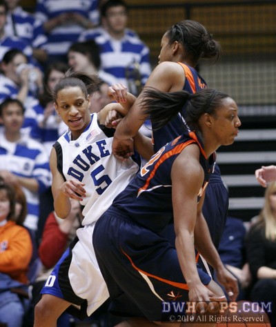 Jasmine Thomas runs into a screen from Telia McCall as Monica Wright dribbles onward -  - 