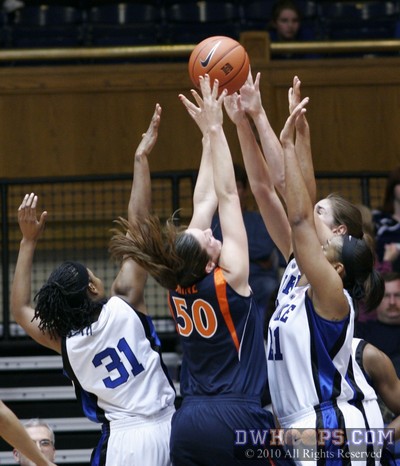 UVa's Chelsea Shine surrounded by Blue Devils on the Hoo's offensive glass. -  - 