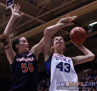 Allison Vernerey fends off Chelsea Shine with one arm while shooting the basketball with the other -  - 