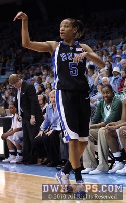 Jasmine Thomas calls a play for Duke as Jessica Breland (green) looks on from the UNC bench. -  - 