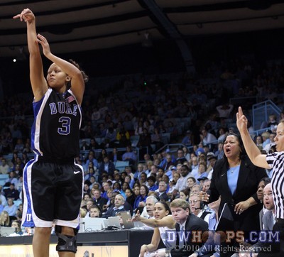 Shay Selby tries an open three as UNC assistant Tracey Williams-Johnson reacts from the bench -  - 