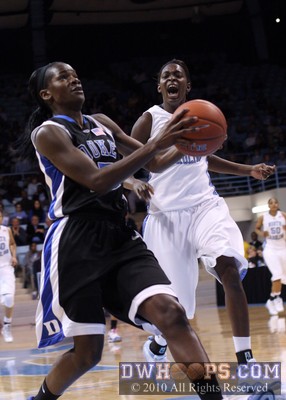 Bridgette Mitchell gears up for a fast break layup as UNC's Waltiea Rolle expresses her displeasure -  - 