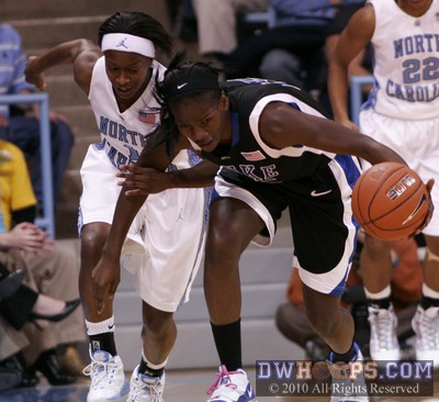 Bridgette Mitchell stole the ball from She'La White, and it wouldn't really be an even trade if White stole Mitchell's arm back. -  - 