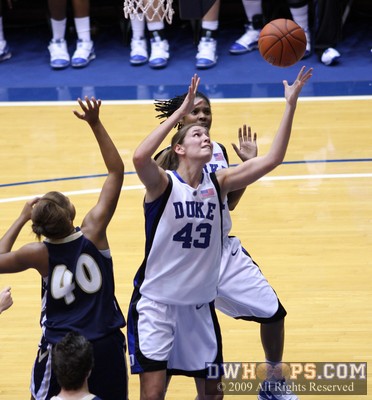 Allison Vernerey goes up for a loose ball -  - 