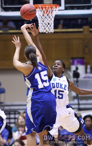 Melanie Warner shoots over Bridgette Mitchell -  - 