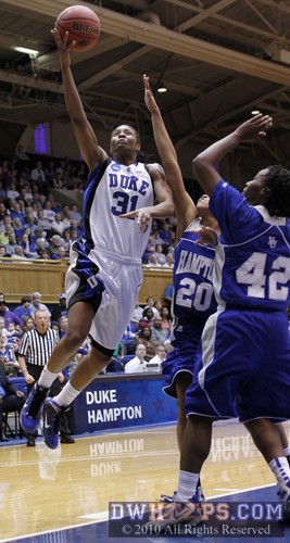 Keturah Jackson tries a layup but is well guarded by Hampton's Laura Lewis (20) -  - 