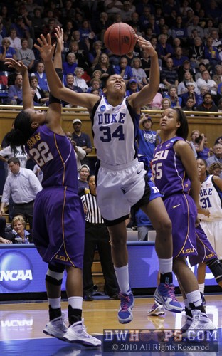 Krystal Thomas loses control of the ball after being fouled by Lasondra Barrett (right, acting like nothing happened). -  - 