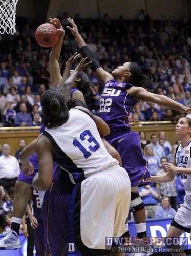Courtney Jones (22) soars into the rebounding fray, the ball ended up out to Duke. -  - 