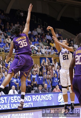 Taylor Turnbow soars in the air as Joy Cheek tries a fruitless three pointer -  - 
