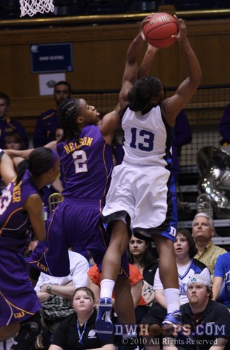 Karima Christmas snares an important rebound as the game is still nip and tuck. -  - 