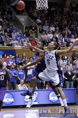 Jasmine Nelson (back) smacked Jasmine Thomas' shot into the backboard.  No, it did not stick there. :) -  - 