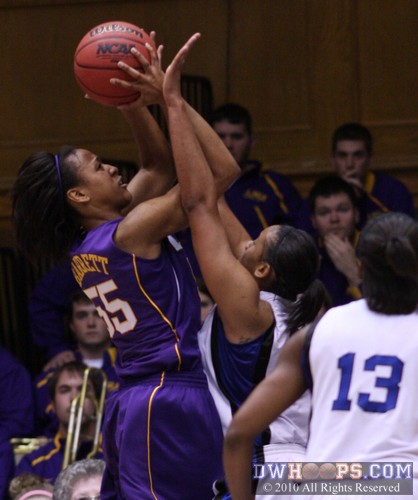 LaSondra Barrett and Joy Cheek meet at the baseline -  - 