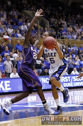 Jasmine Thomas catches her foot on the foot of Destini Hughes, forcing an off-balance shot. -  - 