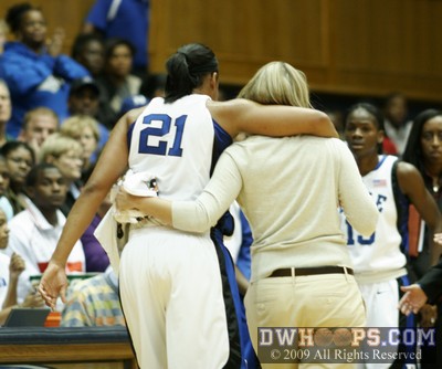 Joy Cheek is helped off the court after tweaking her ankle.  She would return. -  - 