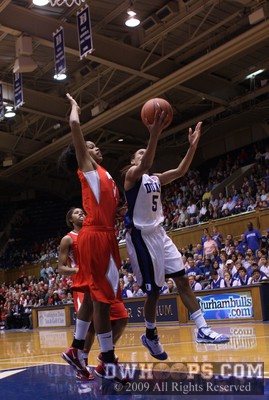 Jasmine Thomas is fouled by Andrea Walker as her layup puts Duke up by ten, 59-49 -  - 