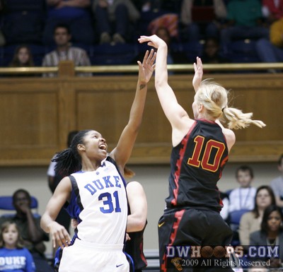 Heather Oliver misses a jumper over Keturah Jackson -  - 