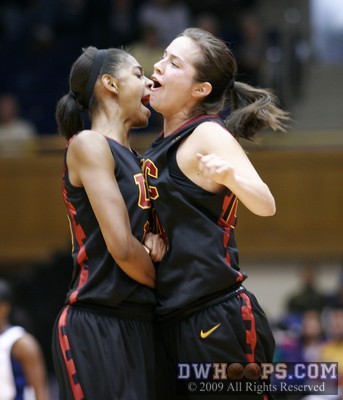 A chest bump for Briana Gilbreath and Ashley Corral (right) after Corral's three put USC up 13, prompting a Duke time out -  - O15.O24;1,4:15,24-37