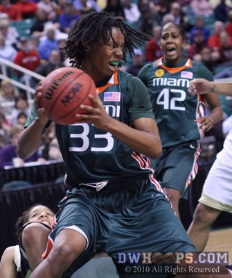 Diane Barnes rips down a rebound for the Canes -  - 