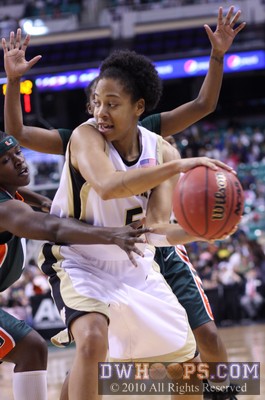 Wake's Courtney Morris passes out of a Miami doubleteam -  - 