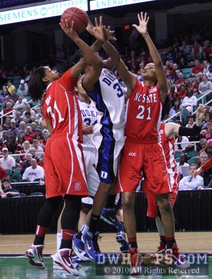 Keturah Jackson snags a Duke offensive rebound and is fouled by NC State's Sharnise Beal (31) -  - 