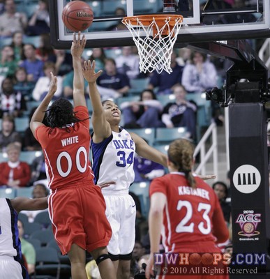 Amber White (00) is fouled in the act by Krystal Thomas -  - 