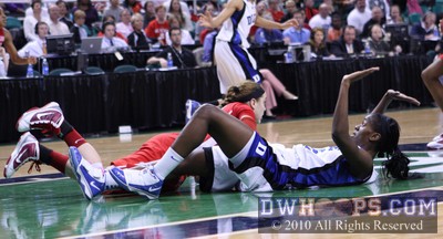 Marissa Kastanek (red) and Bridgette Mitchell on the floor after colliding in the lane -  - 