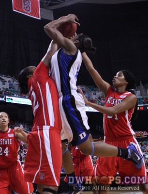 Bonae Holston and Brittany Strachan try to get the ball from Karima Christmas, but a foul was called on Holston -  - 