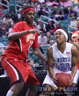 DeGraffenreid glares at the rim as Lynetta Kizer tries to get in-between the two -  - 