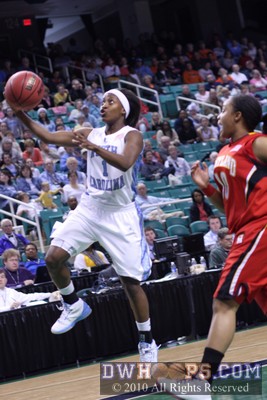 She'La White scores on a fast break -  - 