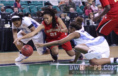 Tierra Ruffin-Pratt, Tianna Hawkins, and Cierra Robertson-Warren lunge for a loose ball -  - 