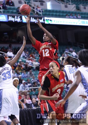 Lynetta Kizer rises above the crowd to hit a mid-range jumper -  - 