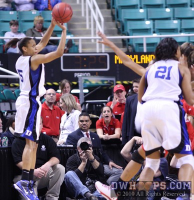 Jasine Thomas hits a trey during an 11-1 Duke run to close the first half -  - 