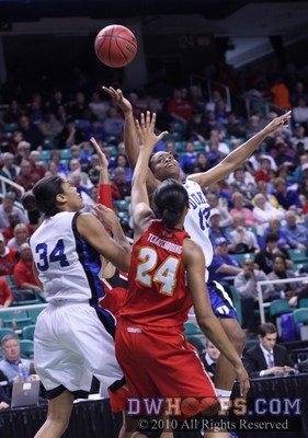 Karima Christmas launches a twisting layup -  - 