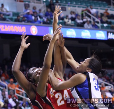 Krystal Thomas stumbles into Tchatchouang after being fouled by Yemi Oyefuwa (obscured) -  - 