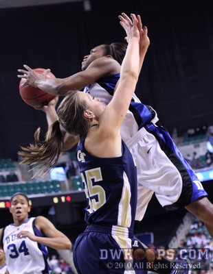 Karima Christmas twists over Brigitte Ardossi while attempting a layup -  - 