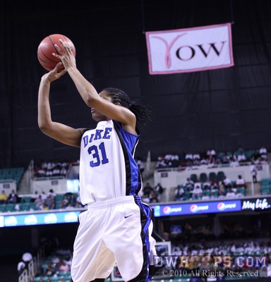 Keturah Jackson knocks down a jumper with the Kay Yow banner in the background -  - 