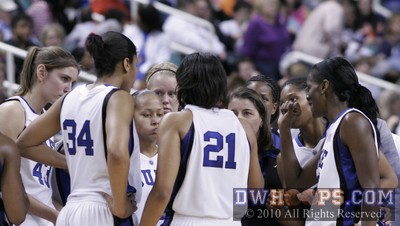 Bridgette Mitchell (far right) smiles during a Duke 30 second time out -  - 