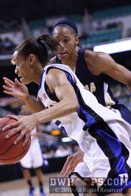 Jasmine Thomas, held scoreless with just one attempt in the first half, dribbles towards the basket in the second period -  - 