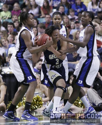 Karima Christmas ties up Sharena Taylor as Keturah Jackson and Bridgette Mitchell (right) look on for the Blue Devils -  - 
